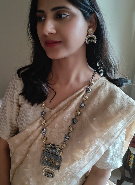 Dual tone set with elephant and peacock motif