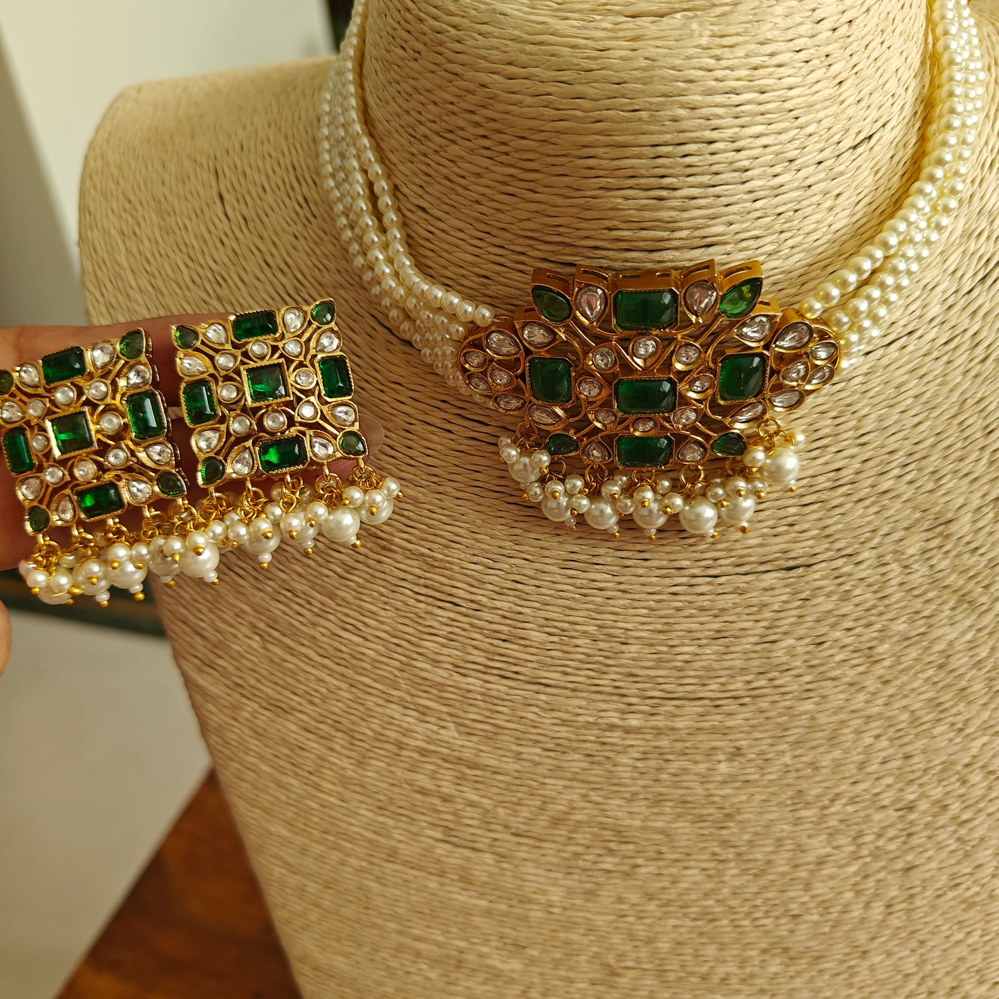 Rupashi choker set with emerald green stones and kundan