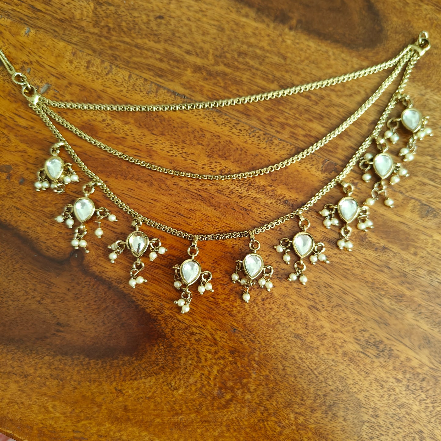 Earchains in antique finish with teardrop tyani kundan hangings