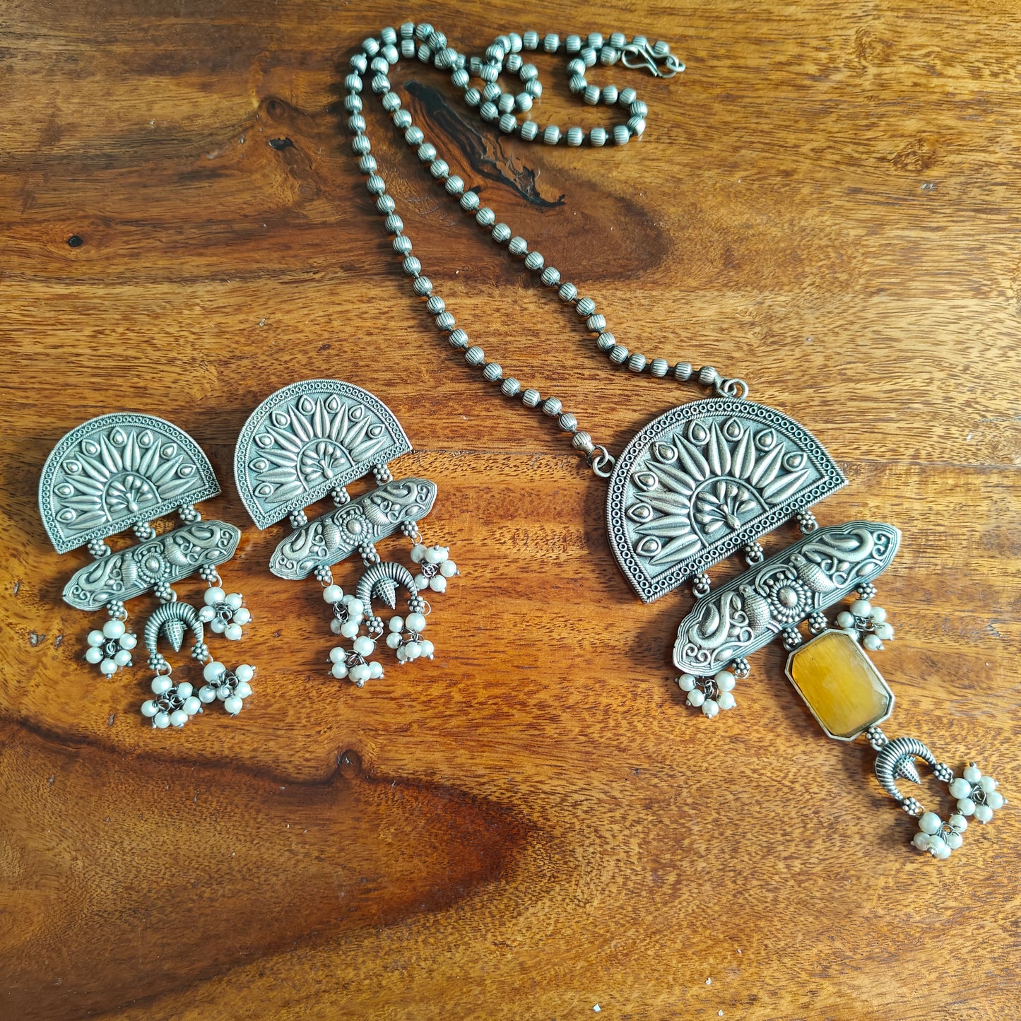 Peacock pendant set with stone and engraving