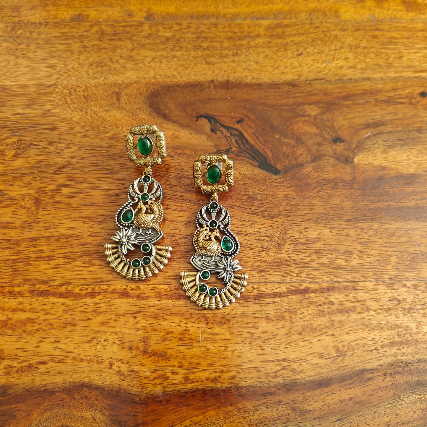 Dual tone earrings with emerald green/sapphire blue stone inlay