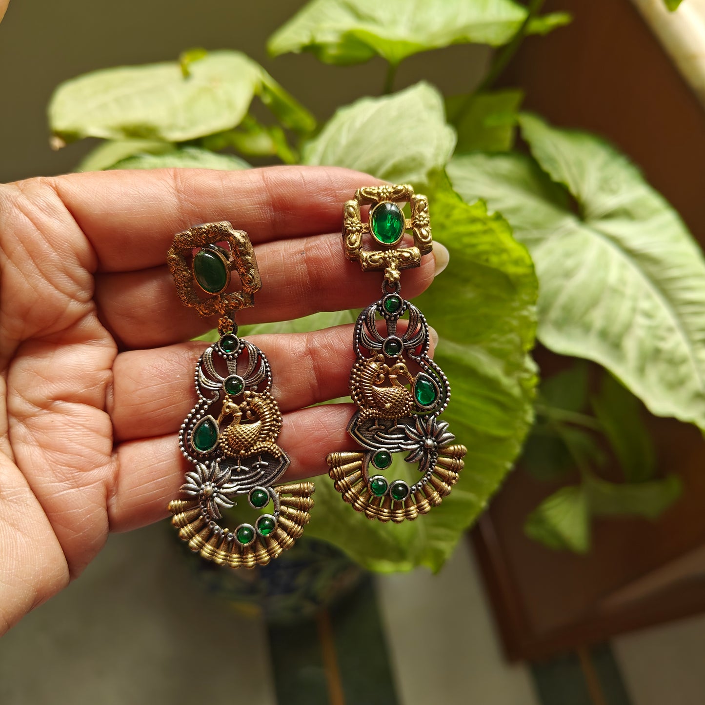 Dual tone earrings with emerald green/sapphire blue stone inlay