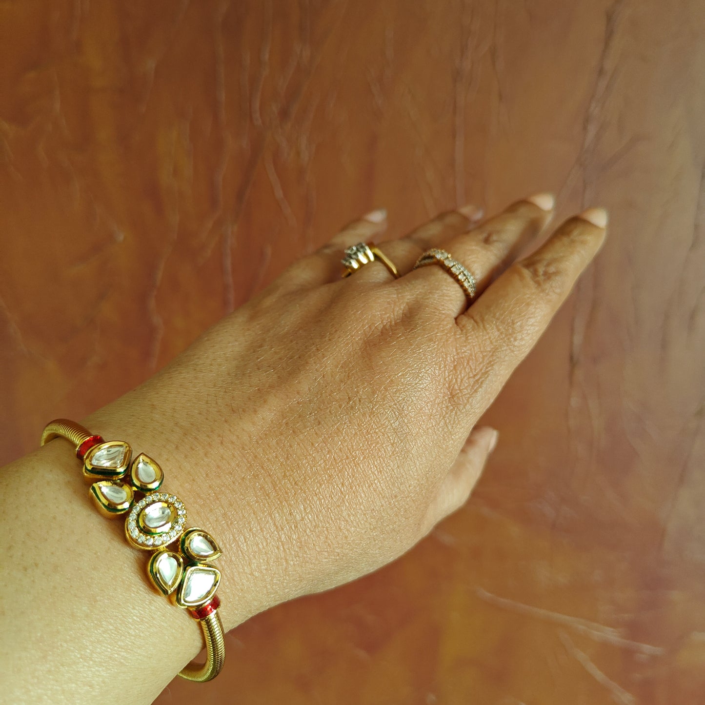 Golden kara with kundan in the centre