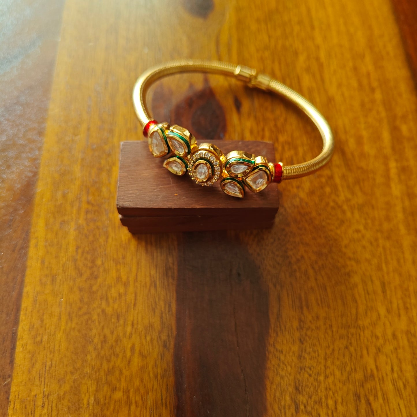 Golden kara with kundan in the centre