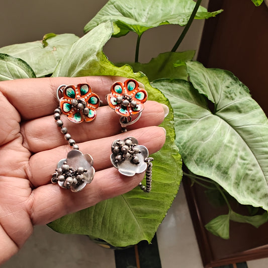Earrings with flower enamel piece on earcuffs