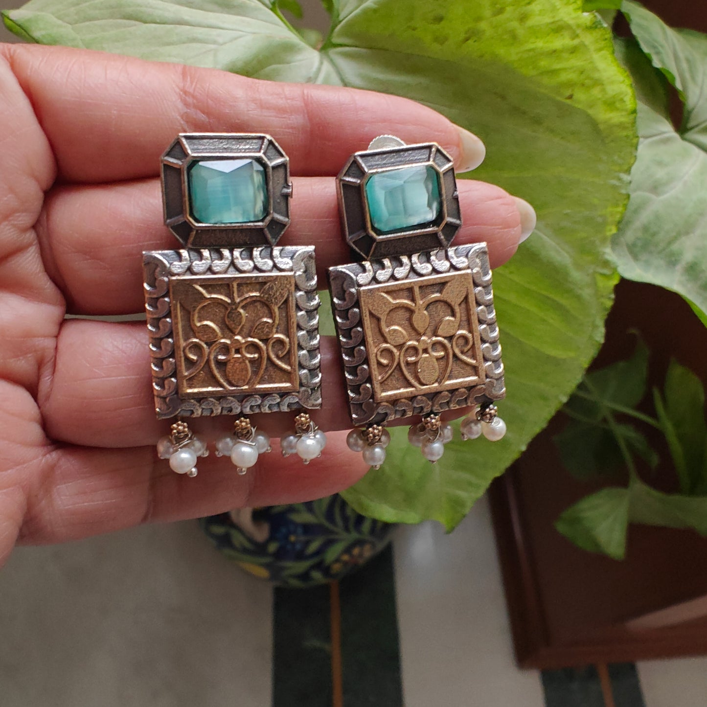 Dual tone earrings with stone and engraving