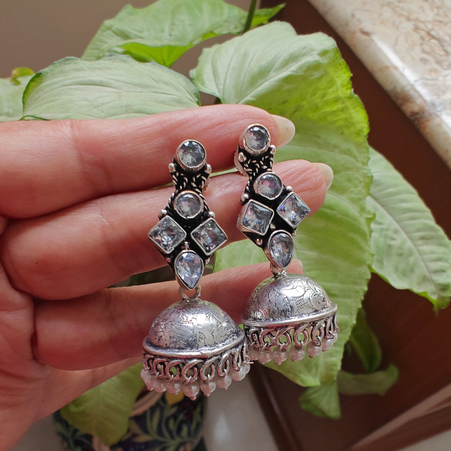 Stone earrings with jhumkis below