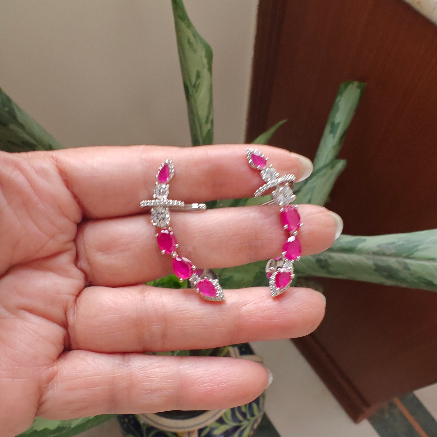 Earrings with cuff in platinum finish with stone along upper ear