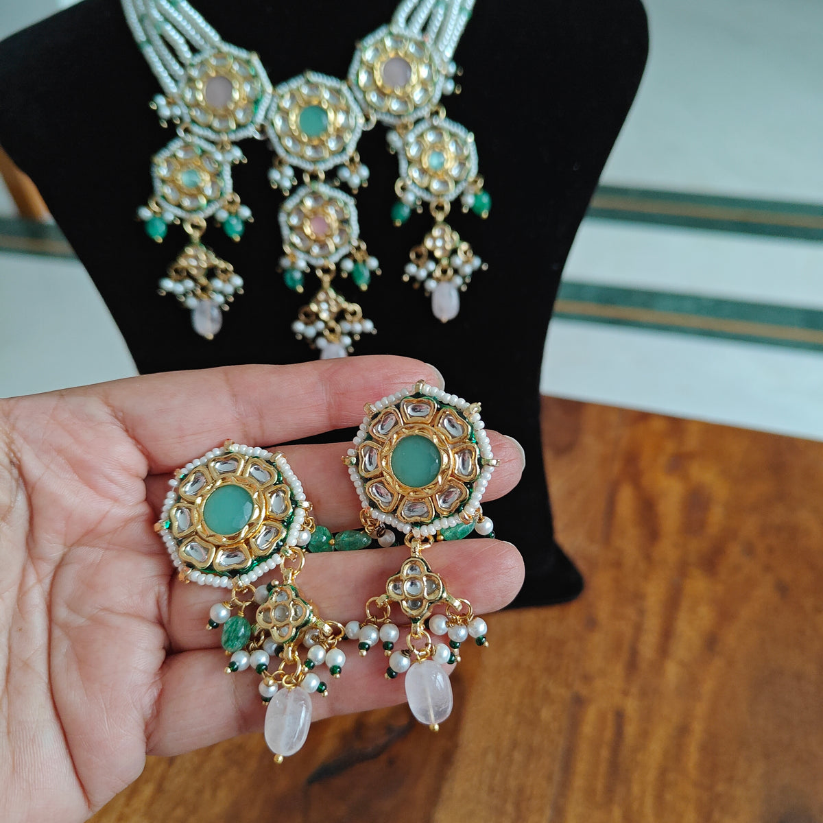 Rujula set with kundan and stone pieceson pearl strings