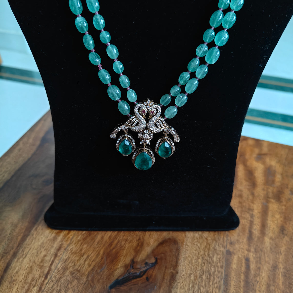 Rachna set with stone strings and peacock pendant