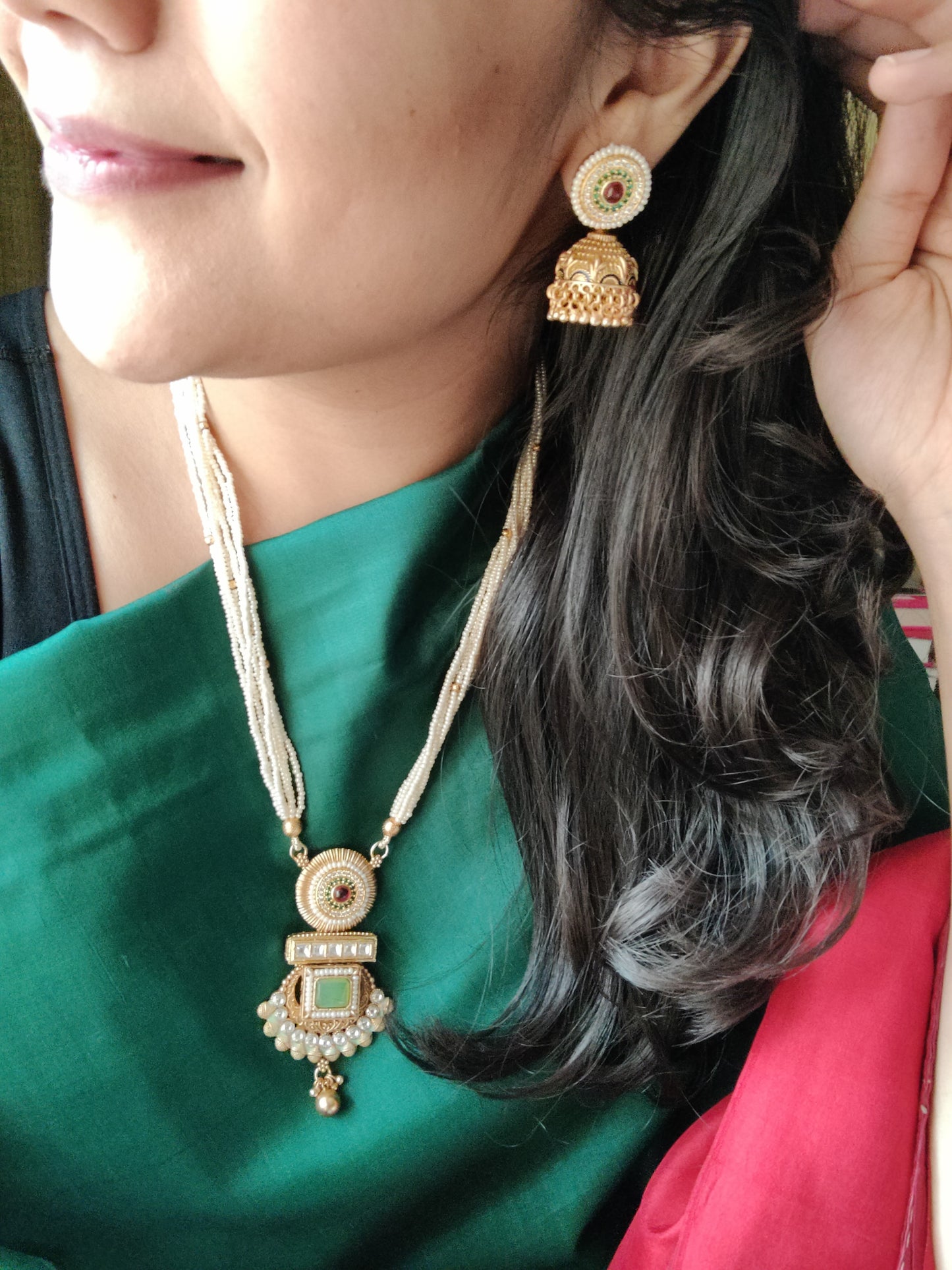 Gold finish set with stone,meenakari and kundan pendant in poth pearl strings with stunning matching jhumkis (earrings)