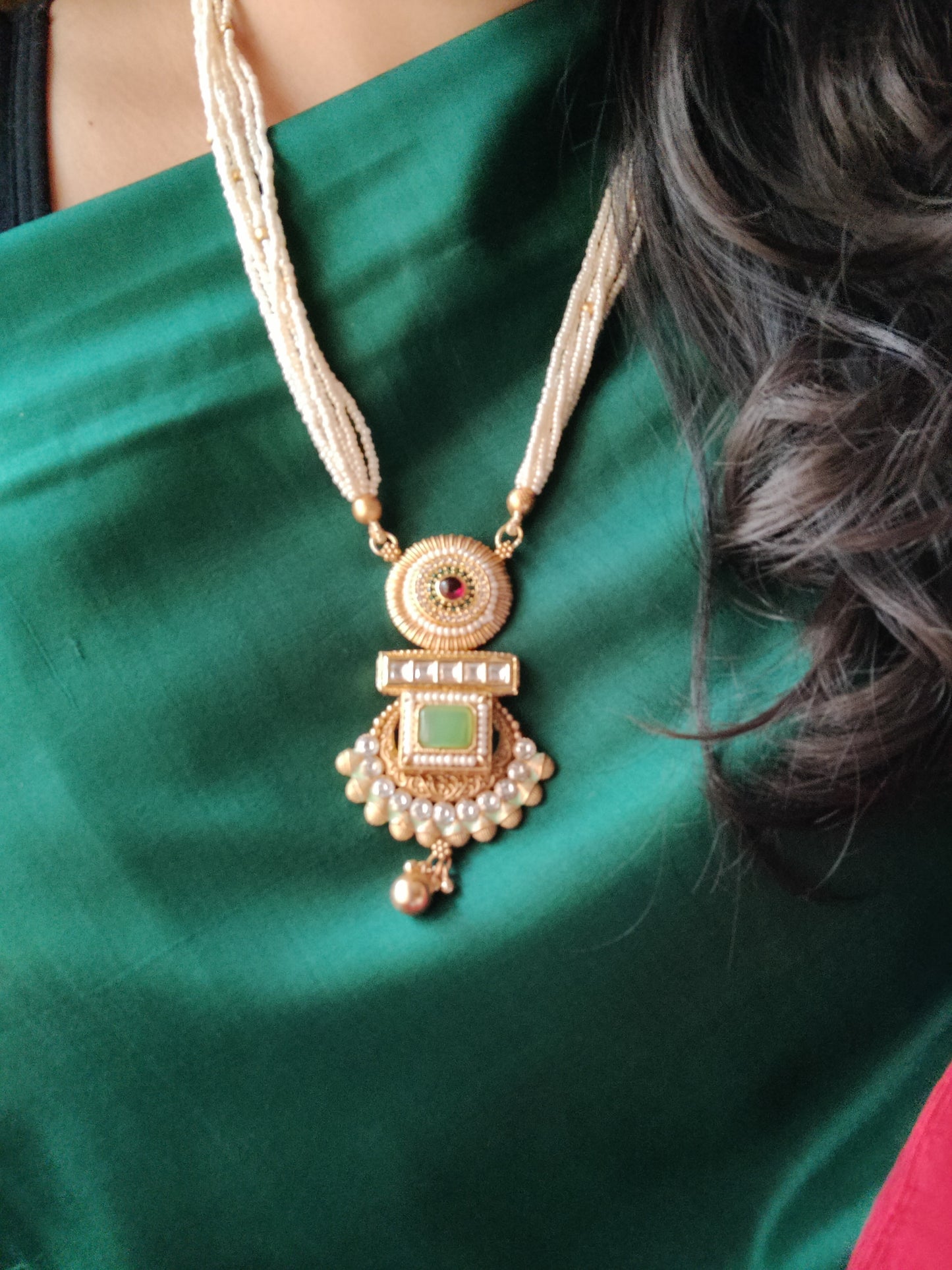 Gold finish set with stone,meenakari and kundan pendant in poth pearl strings with stunning matching jhumkis (earrings)