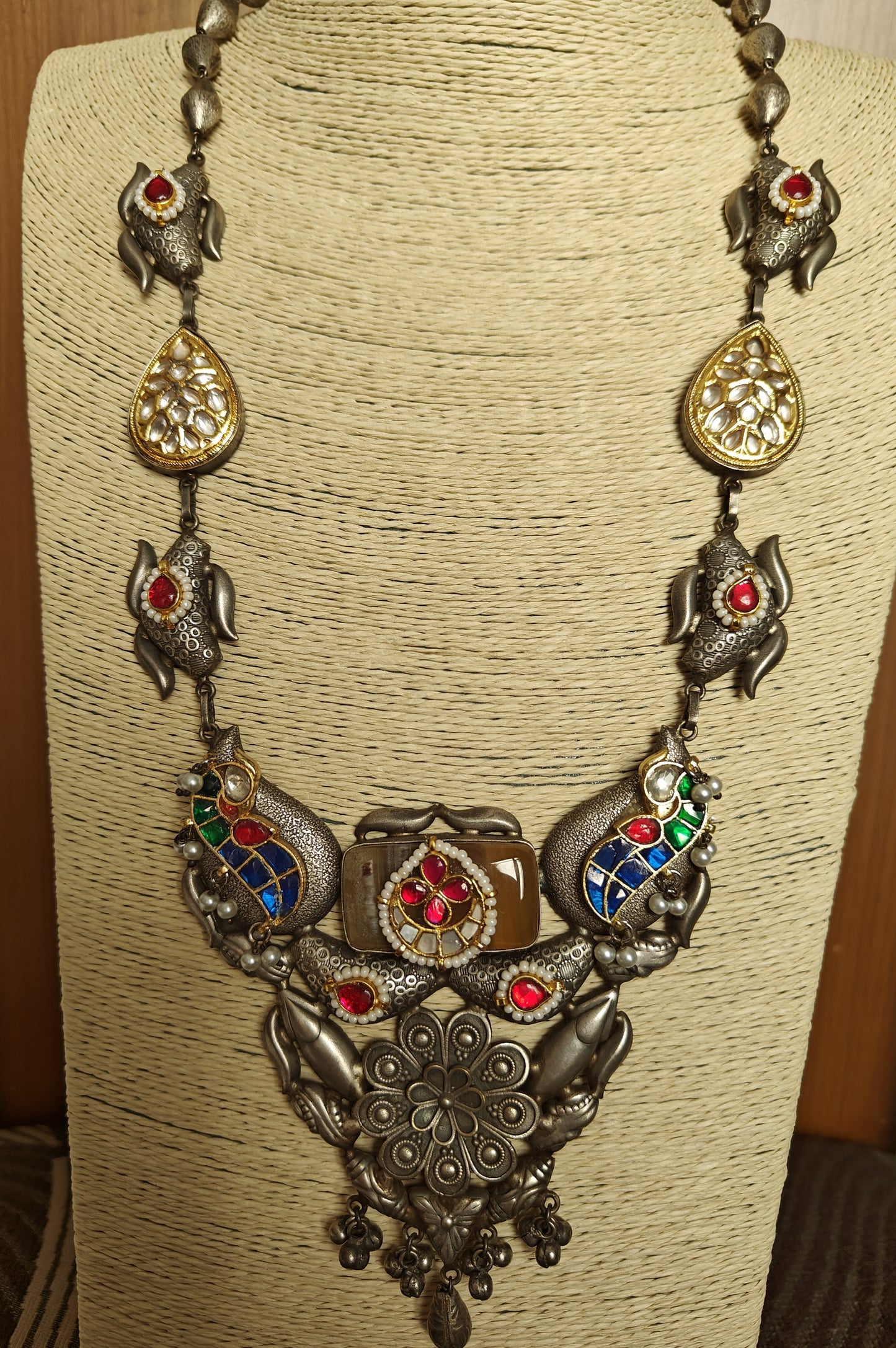 Big necklace in antique Silver finish with stone work in blue,green,red and poth pearls on top of pieces