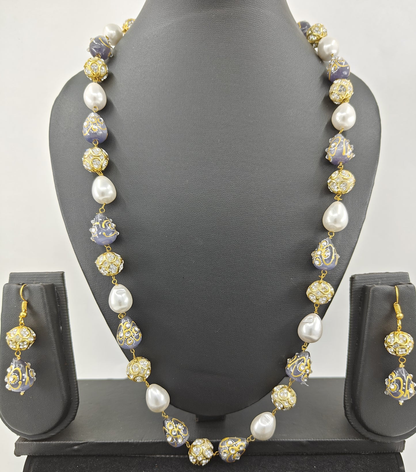 Set with baraque pearls,worked upon beads , matching earrings