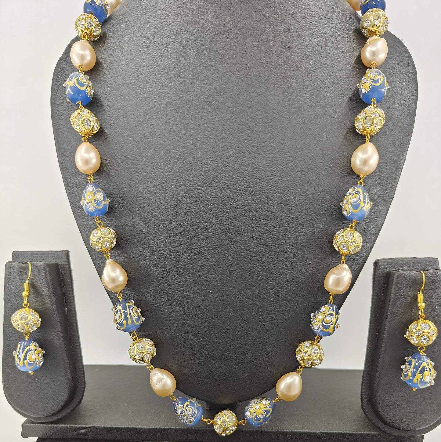 Set with baraque pearls,worked upon beads , matching earrings