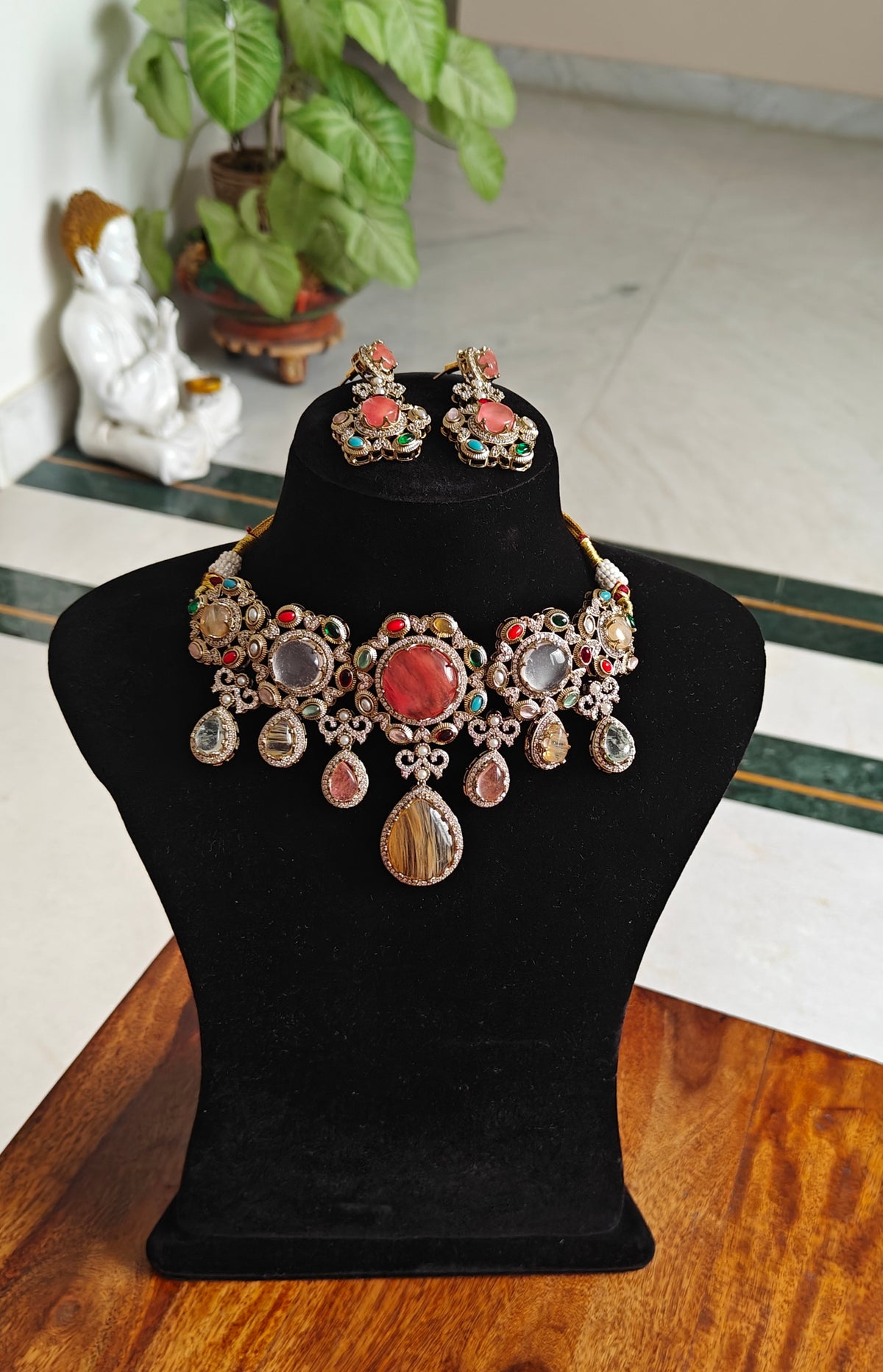 Teja set with  multicolour stone pieces surrounded with navratan stones