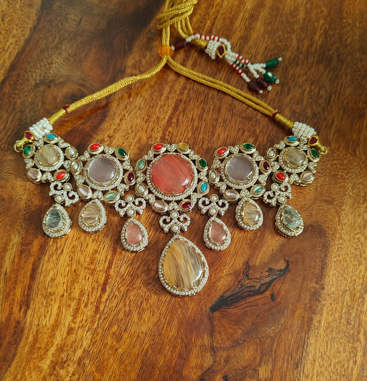 Teja set with  multicolour stone pieces surrounded with navratan stones