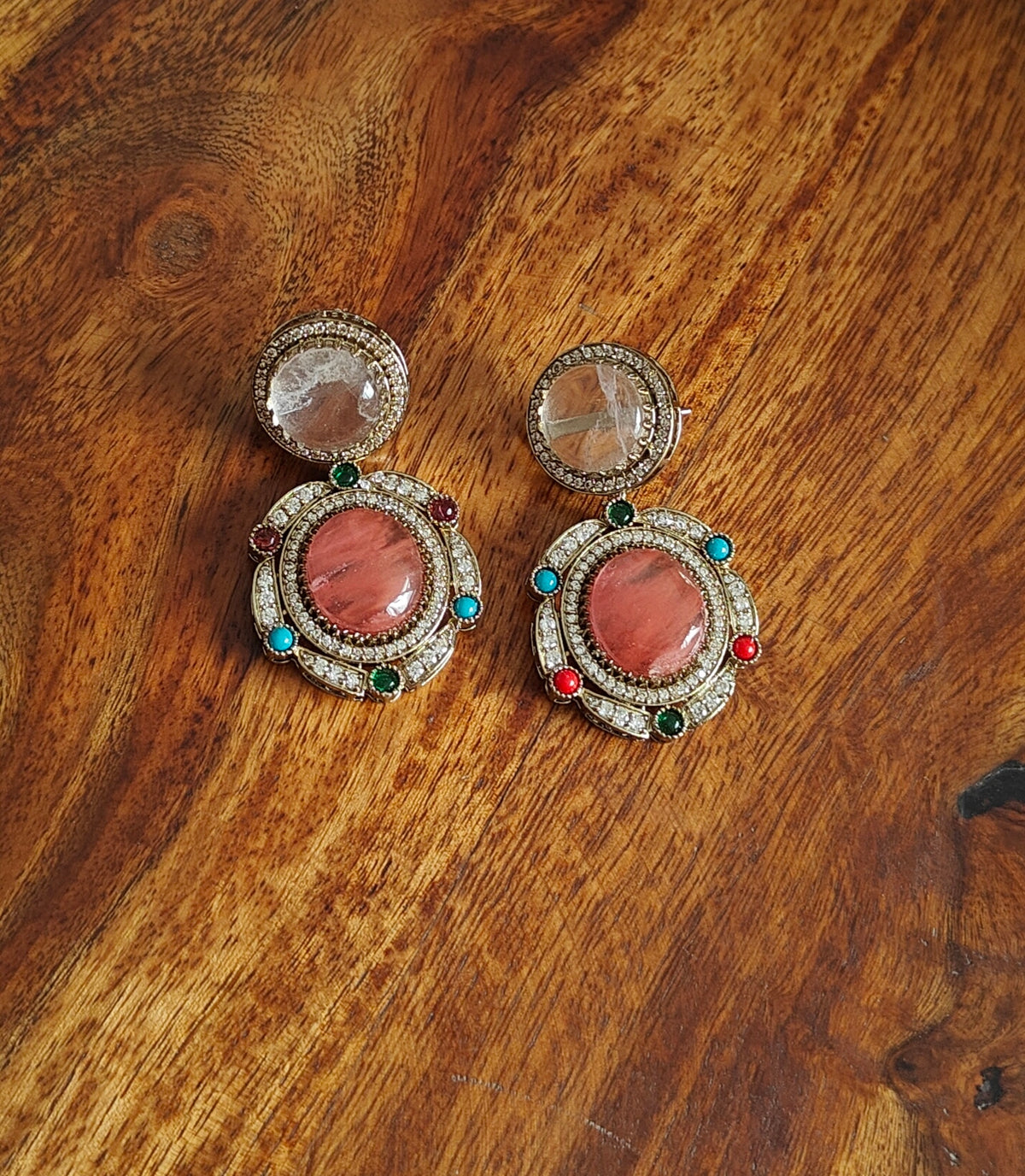 Swaha set with multicolour stones, pendant below with navratan highlights.
