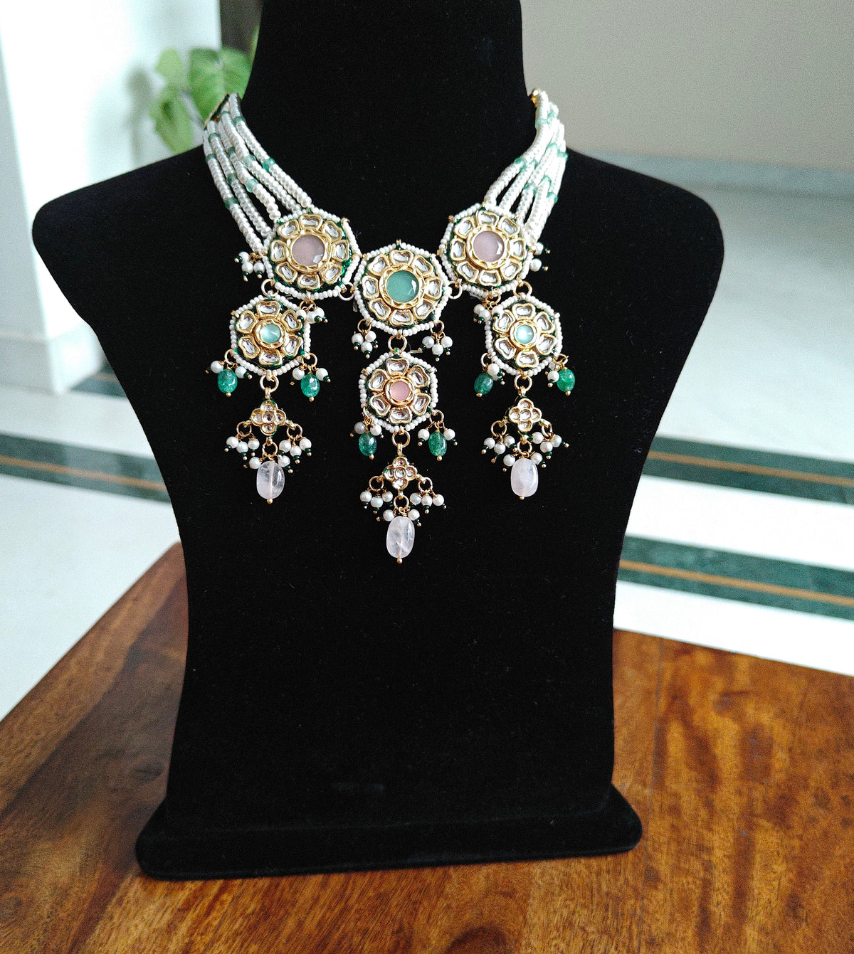 Rujula set with kundan and stone pieceson pearl strings