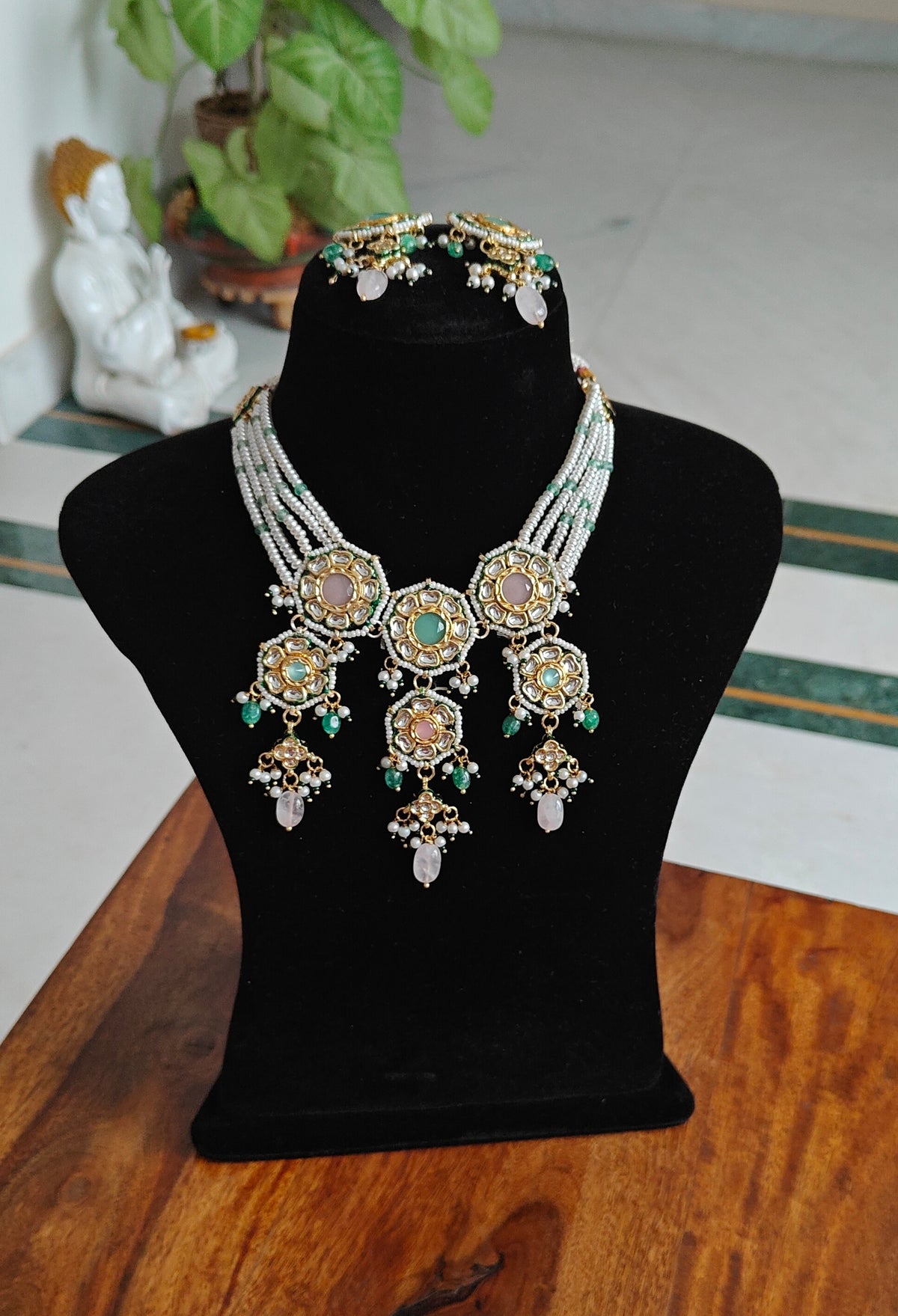 Rujula set with kundan and stone pieceson pearl strings