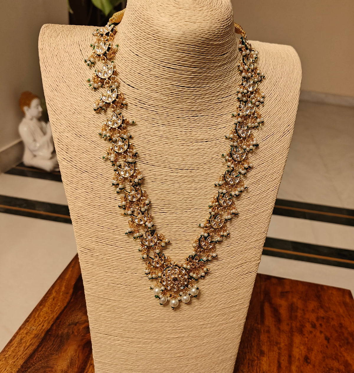 Rajshri set with kundan pieces and pearls hangings