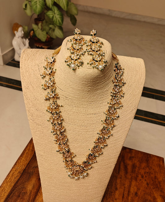 Rajshri set with kundan pieces and pearls hangings