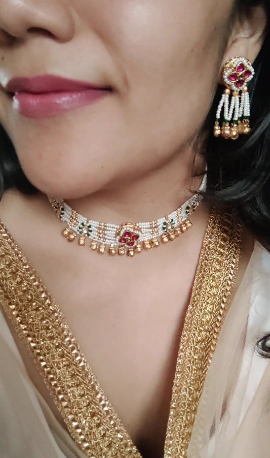 Ekta set with stone work on poth pearls