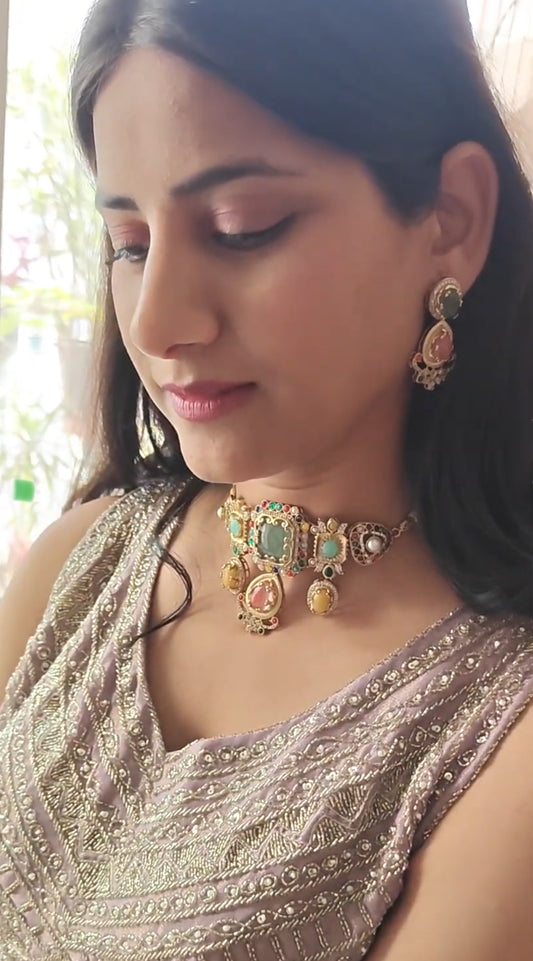 Urvi choker set with emerald green stone and Navratan stones