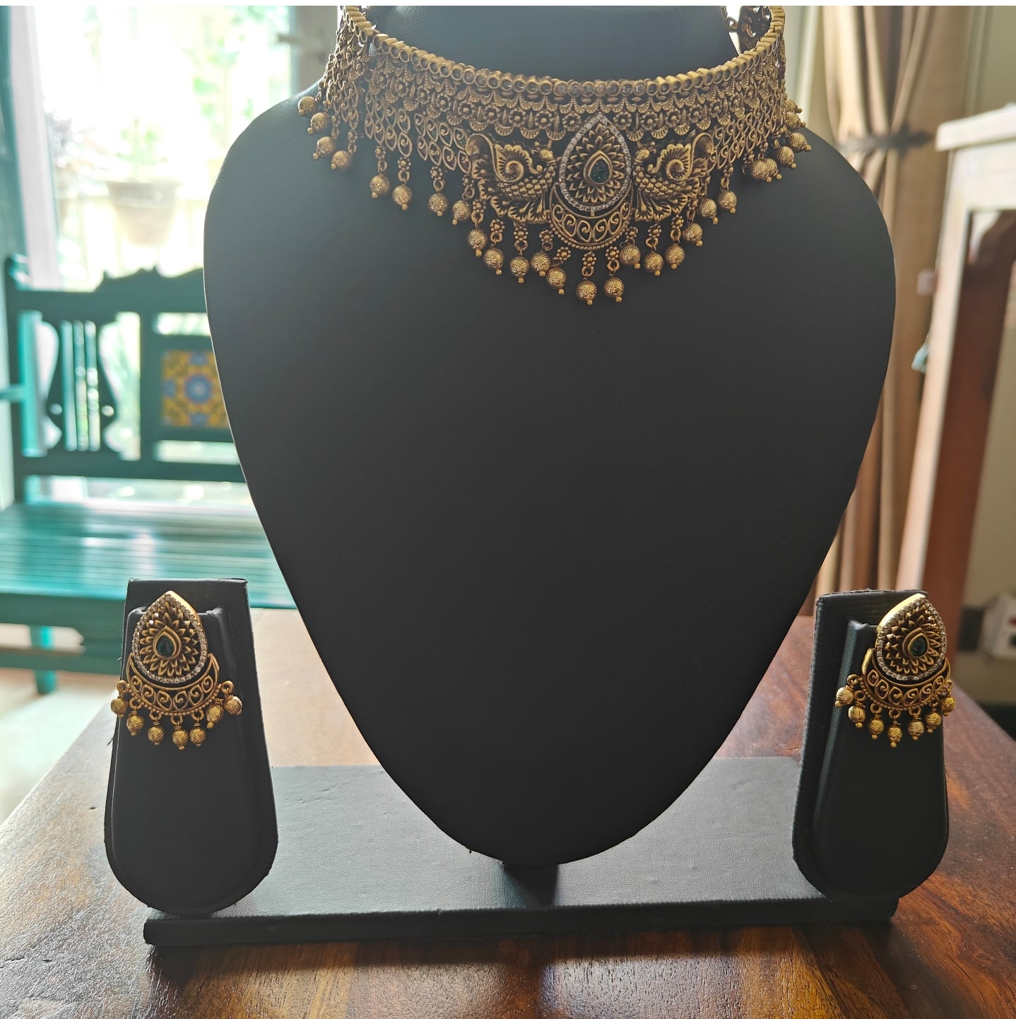 Putul choker with intricate work and peacock motifs