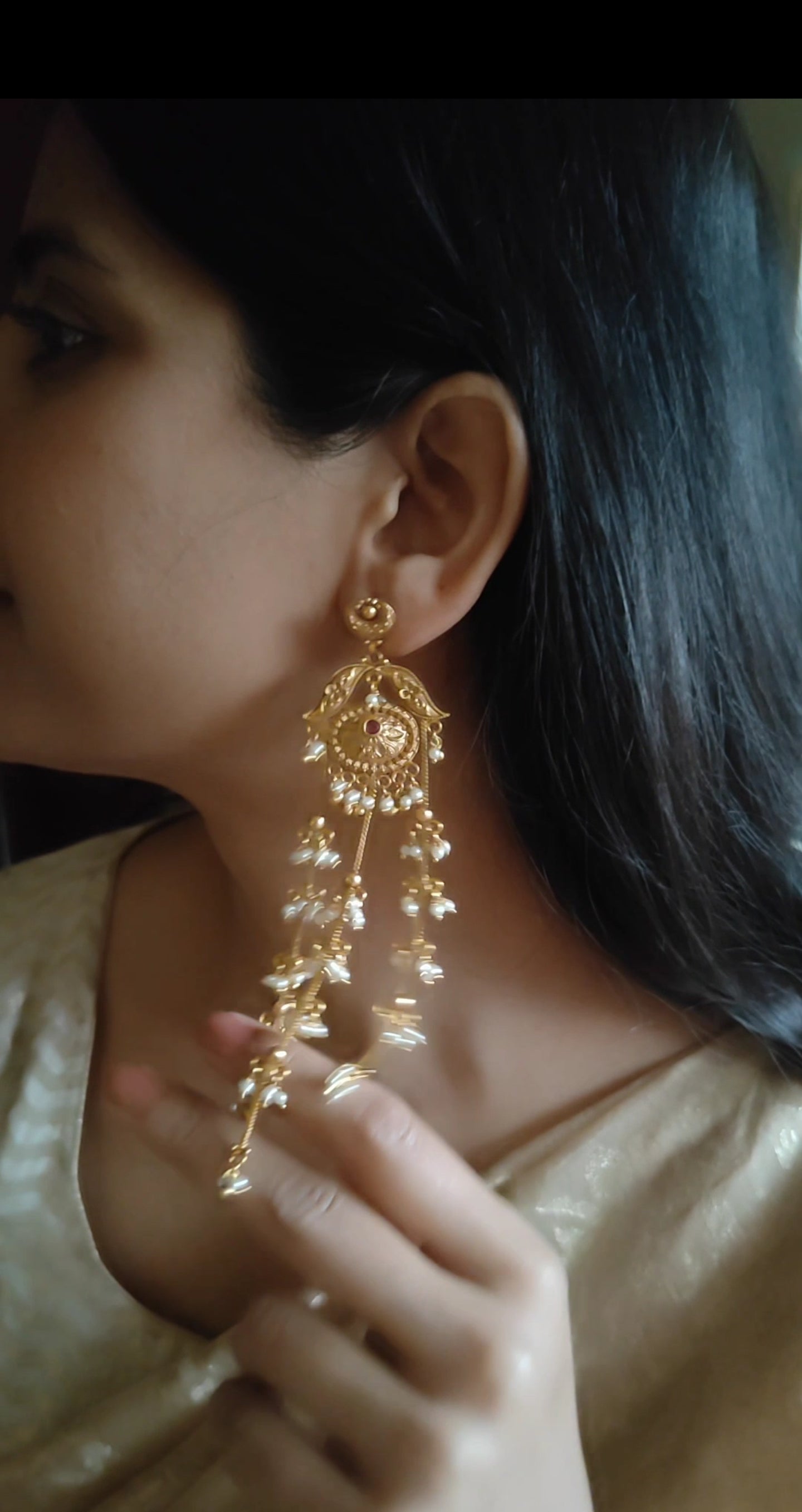 Gold earrings with pearls clusters hanging on three chains