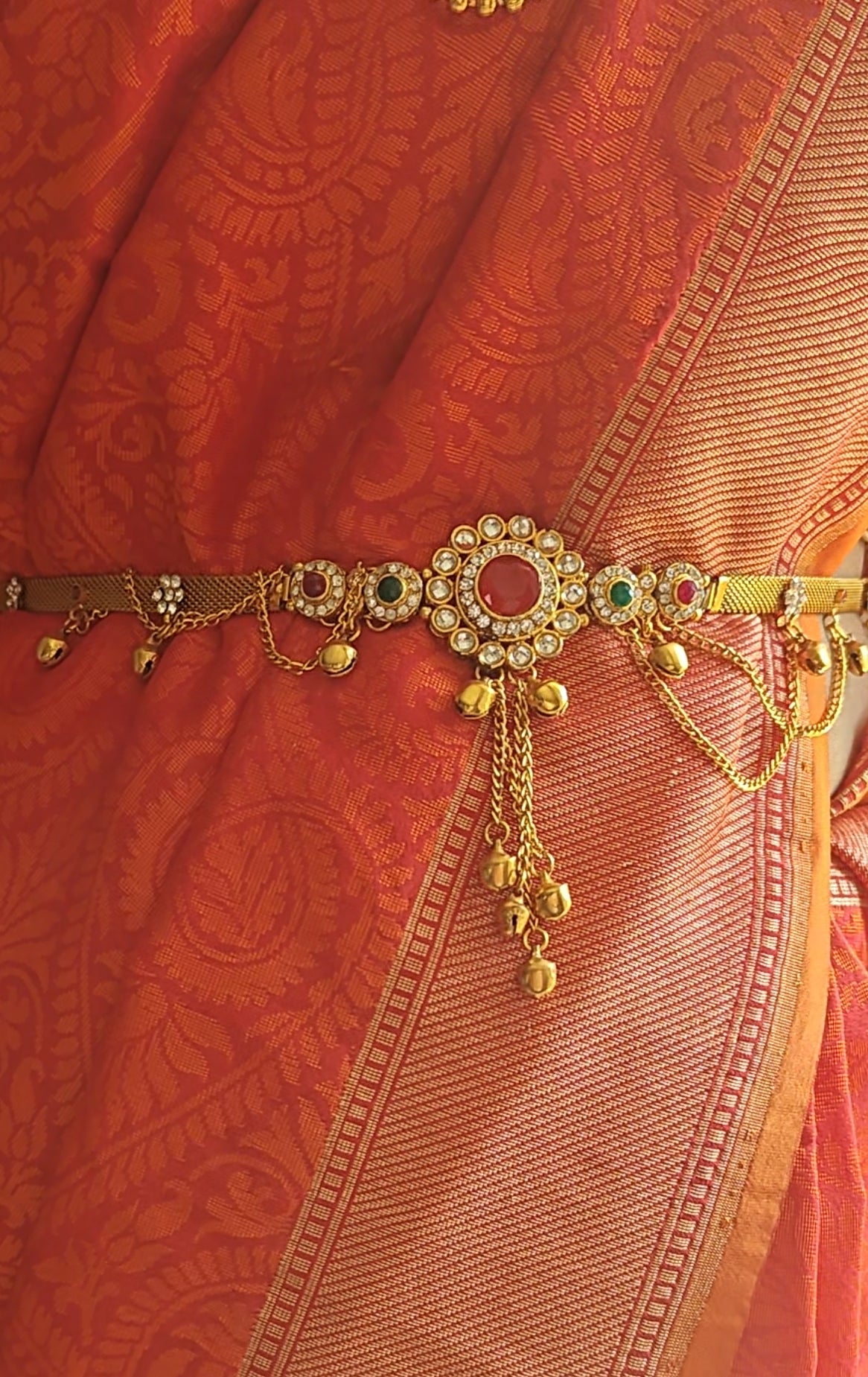 Belt with red/clear stone in centre and hangings all around