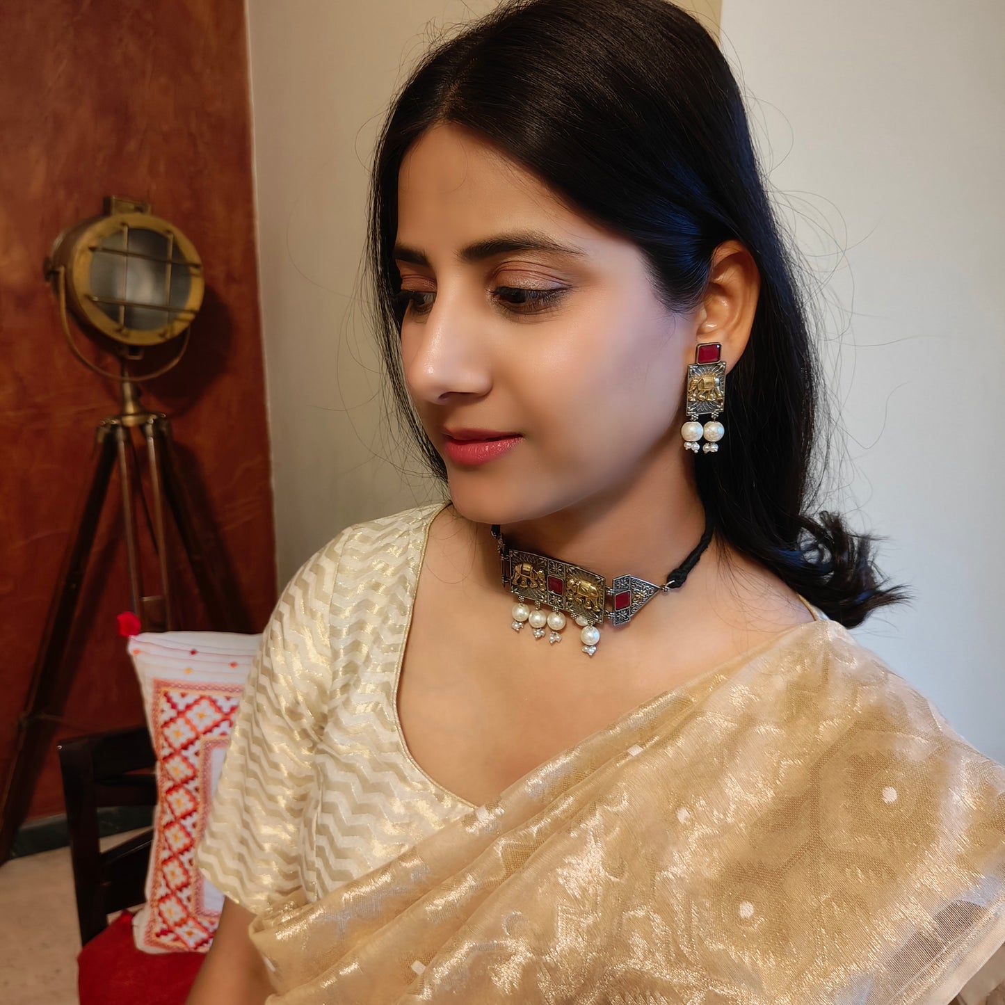 Dual tone choker with elephant engraving and stone
