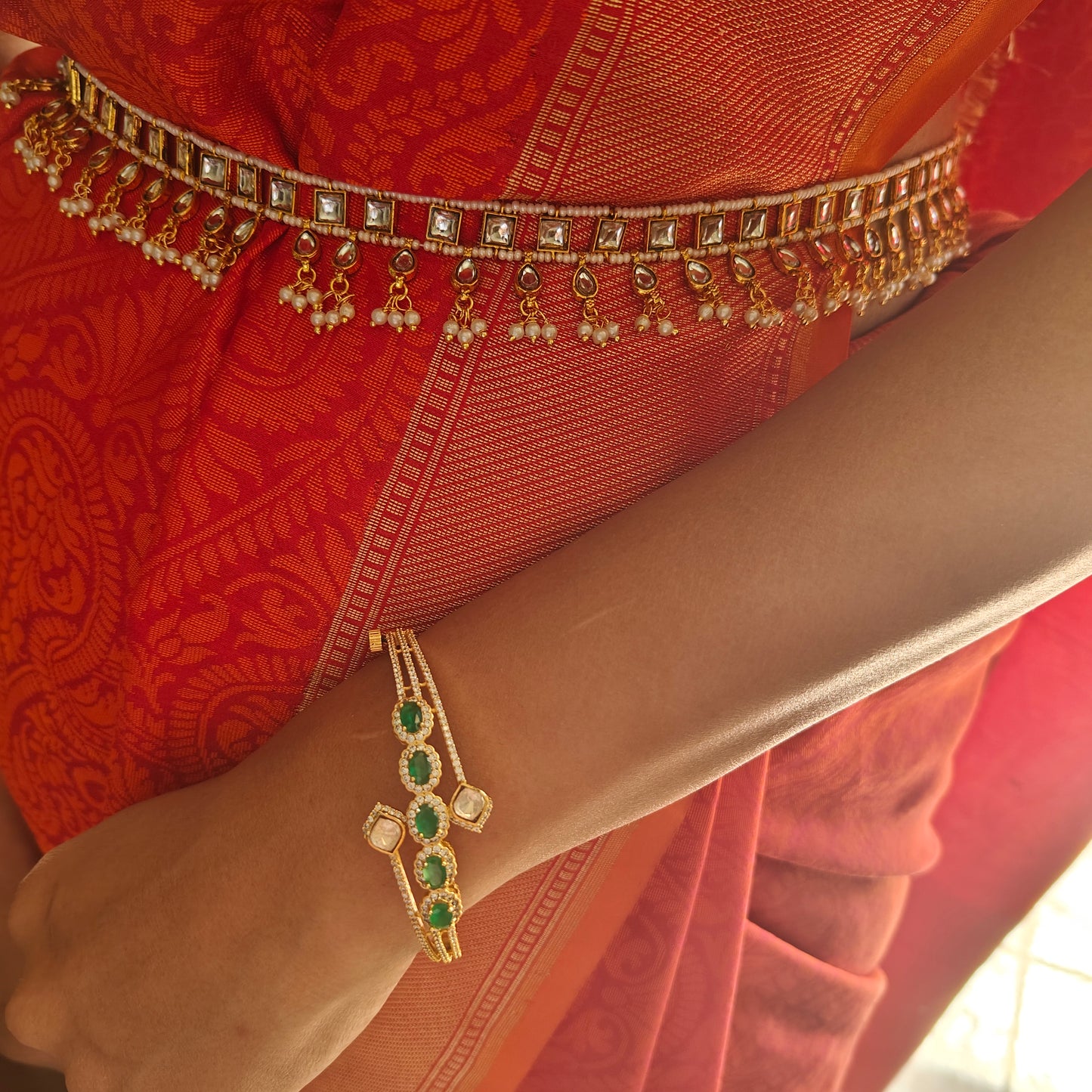 Golden belt with kundan on pearl strings, hangings below