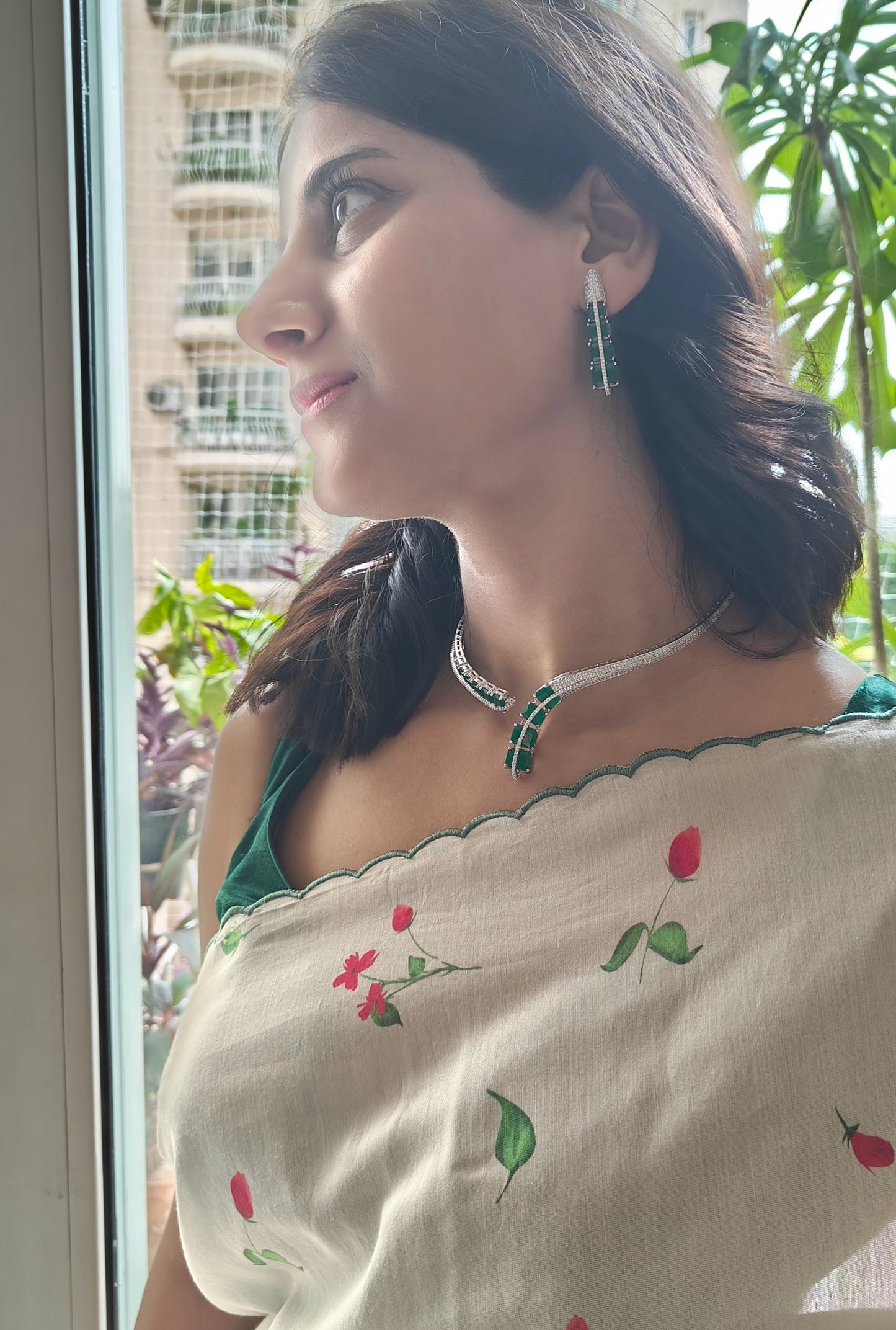 Pival set with green emeralds and Cz