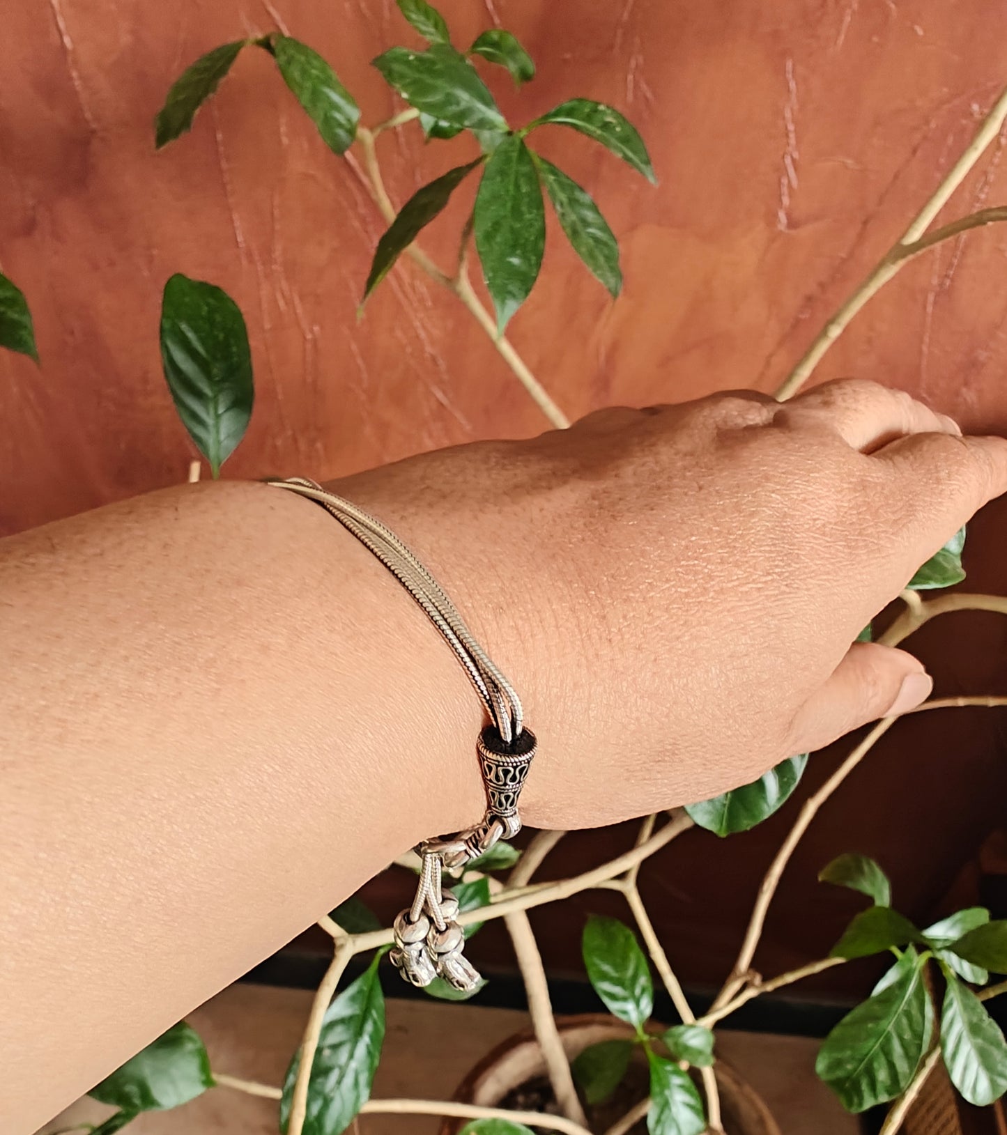 Trikaya silver bracelet with hangings