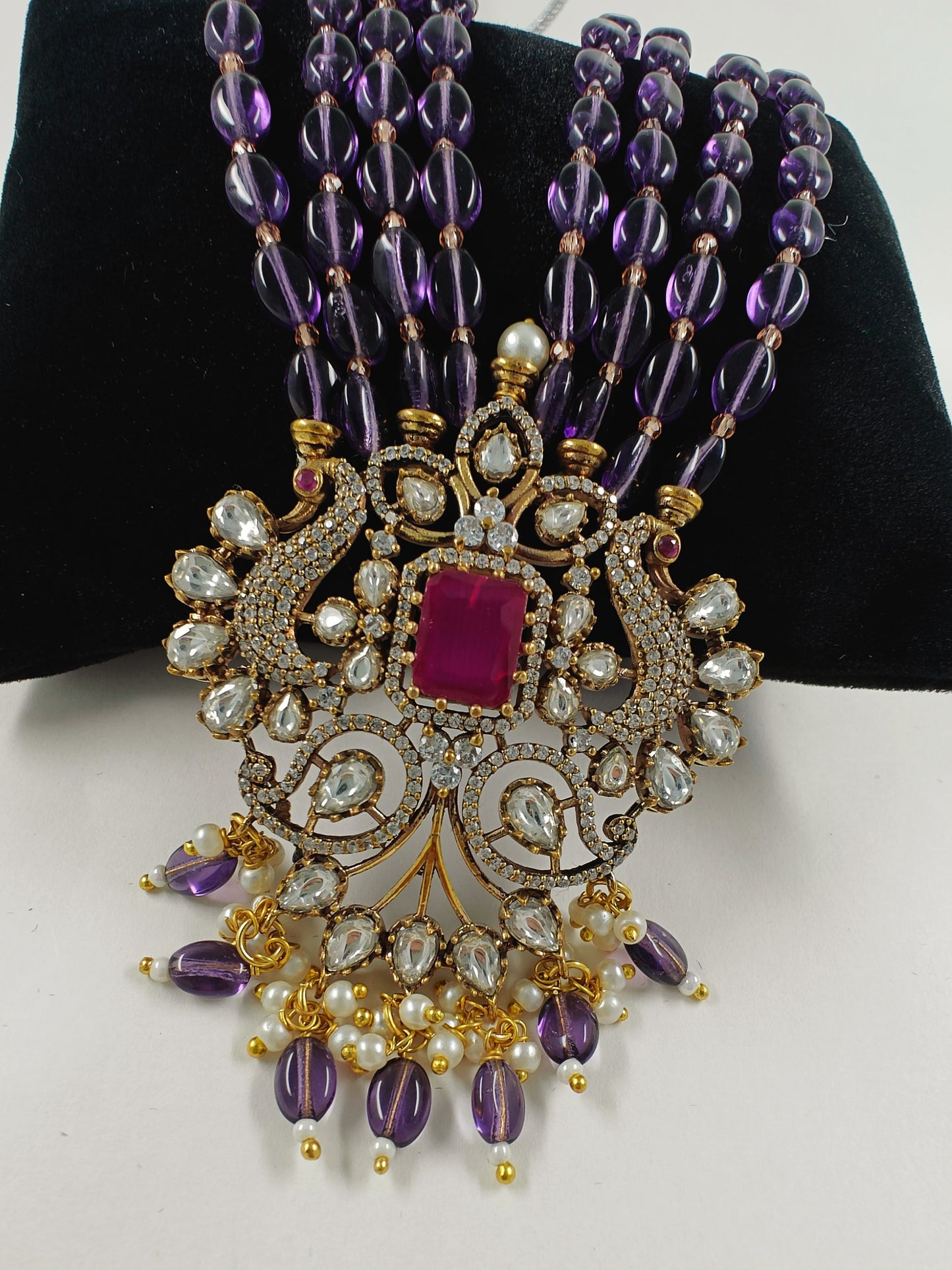 Antique finish set in kundan, CZ and amethyst stone colour