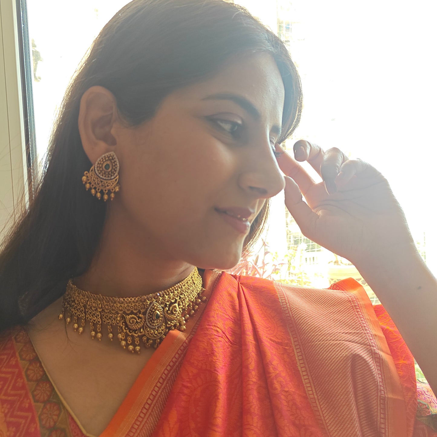 Putul choker with intricate work and peacock motifs