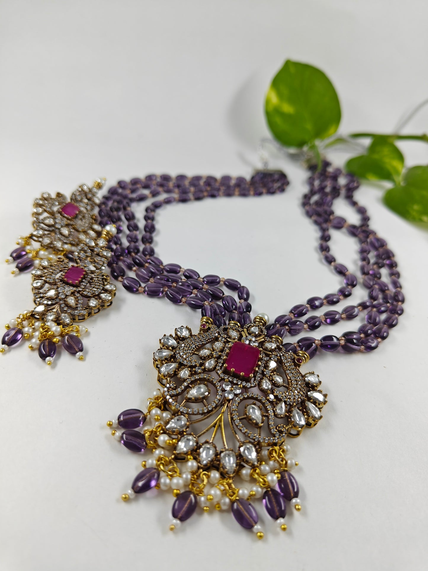 Antique finish set in kundan, CZ and amethyst stone colour