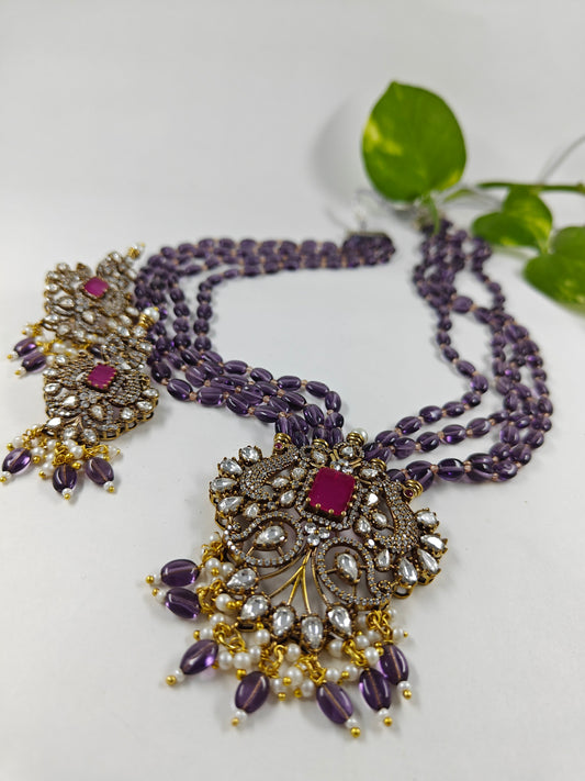 Antique finish set in kundan, CZ and amethyst stone colour