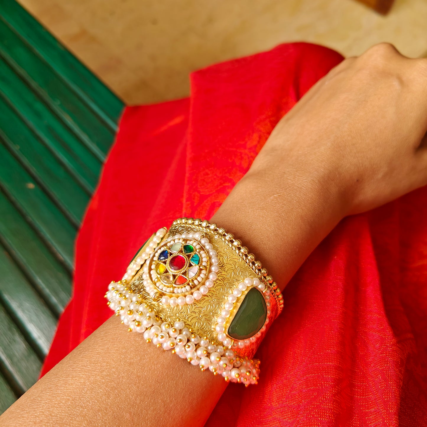 Golden Kara with navratan stones and pearls