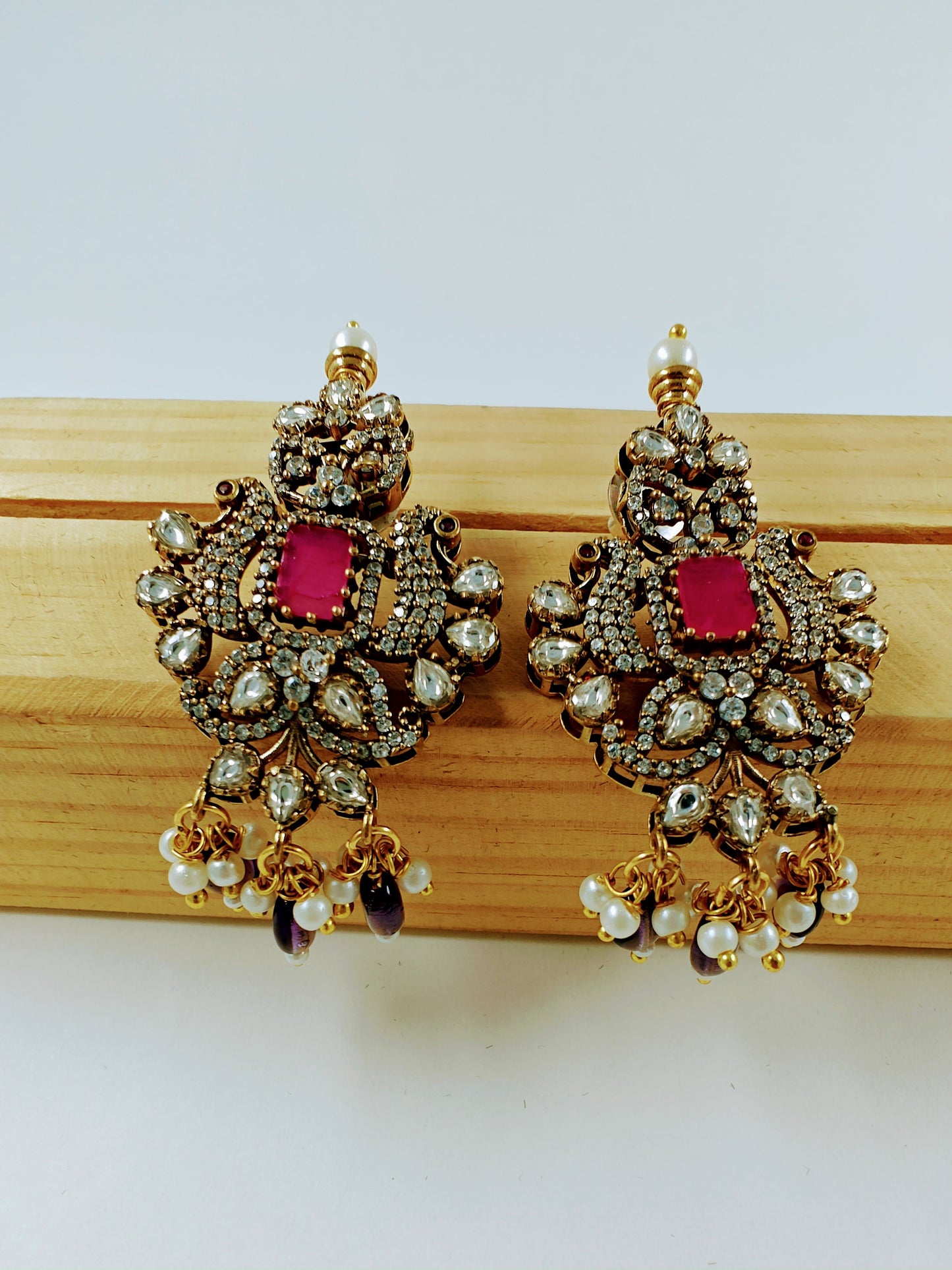 Antique finish set in kundan, CZ and amethyst stone colour