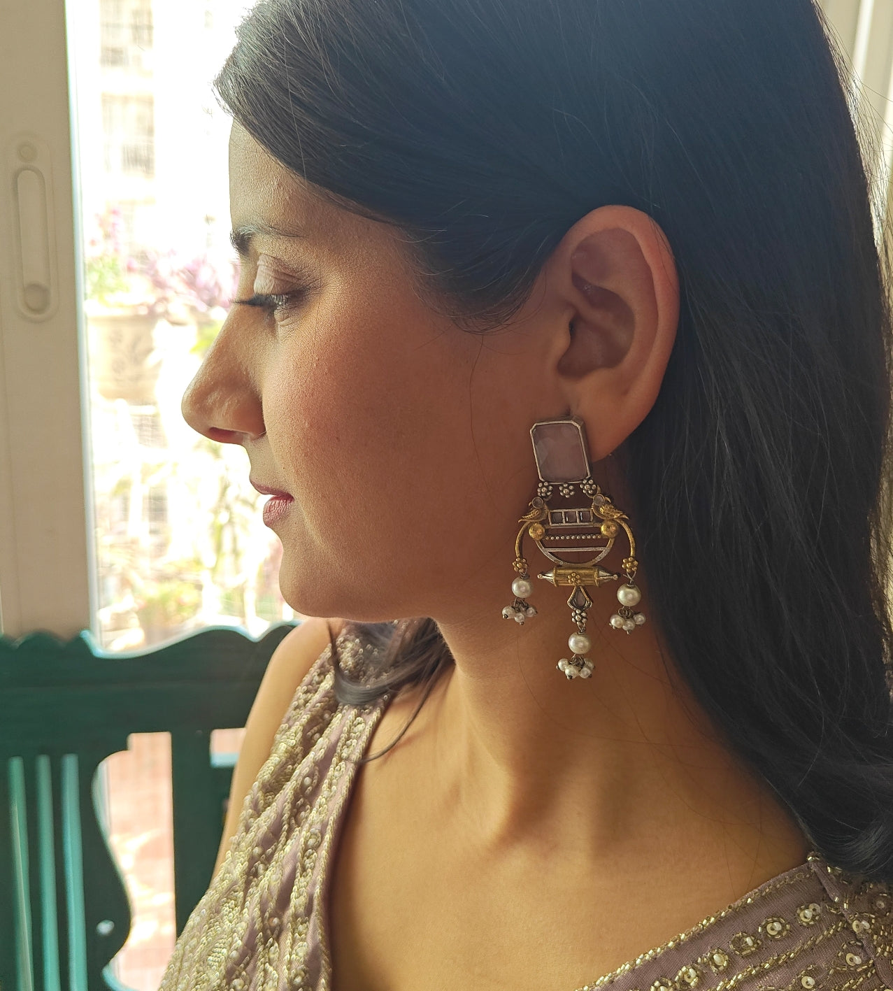 Dual tone earrings with birds and pearl hangings