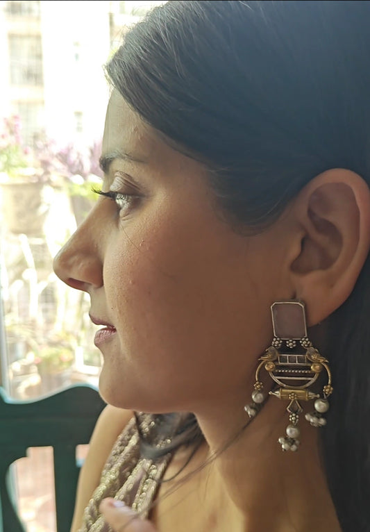 Dual tone earrings with birds and pearl hangings