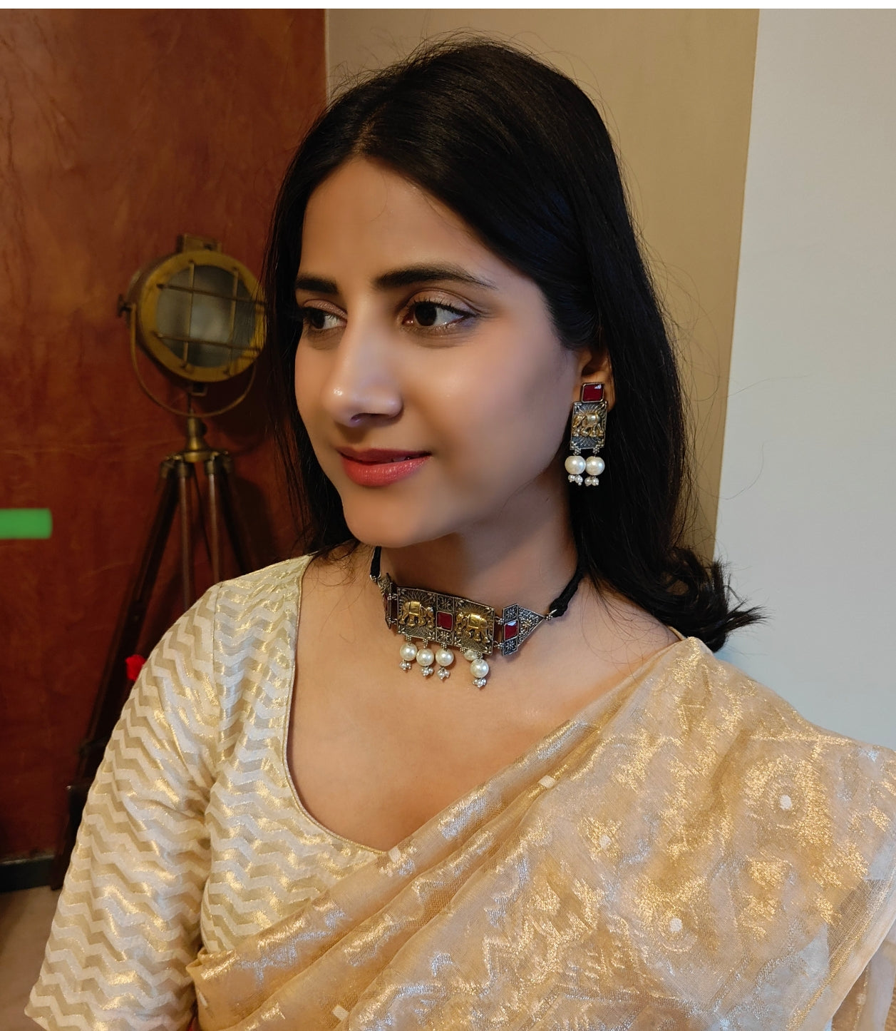 Dual tone choker with elephant engraving and stone