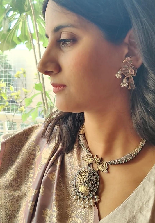 Dual tone set with peacocks and stones