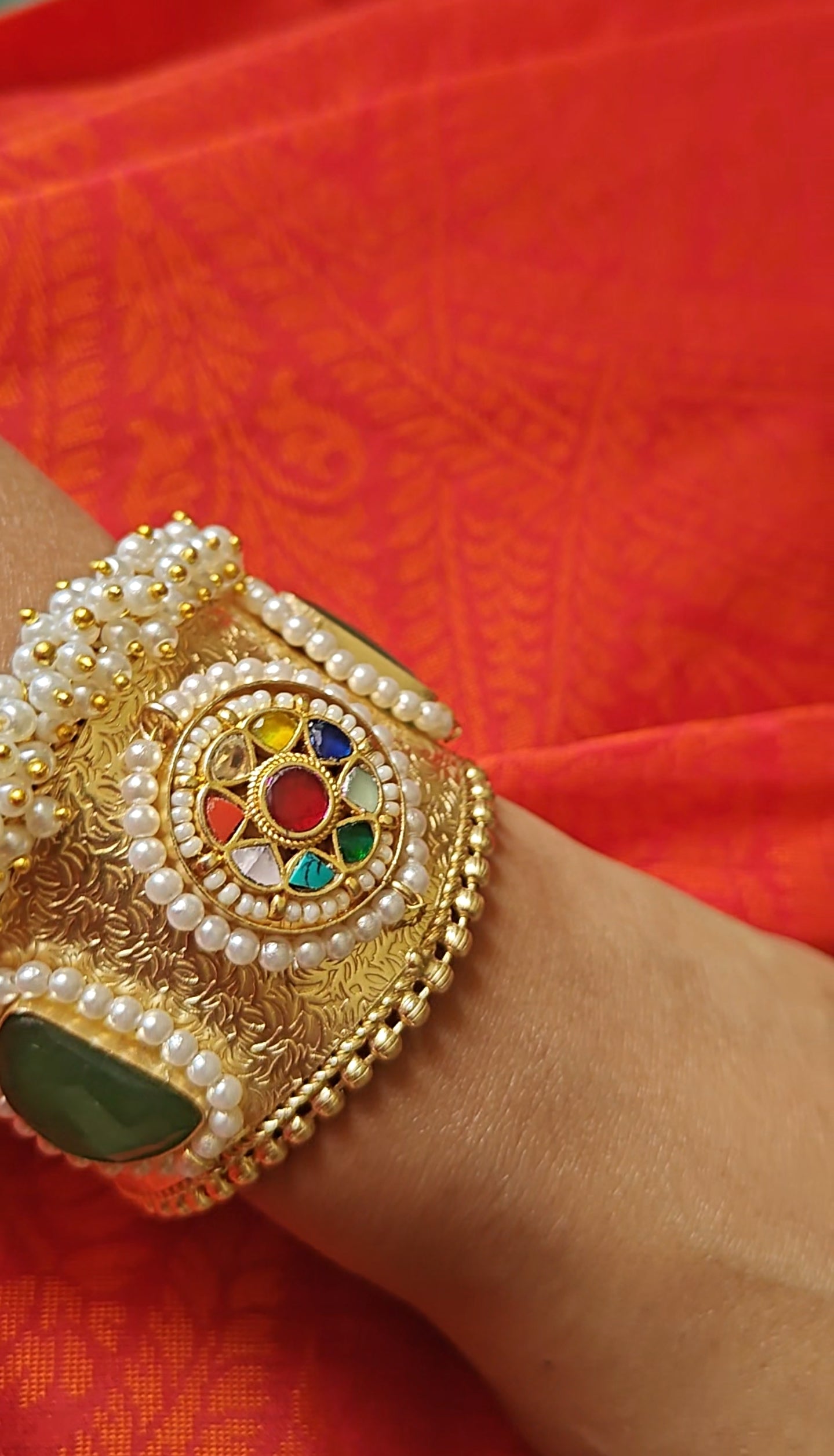 Golden Kara with navratan stones and pearls