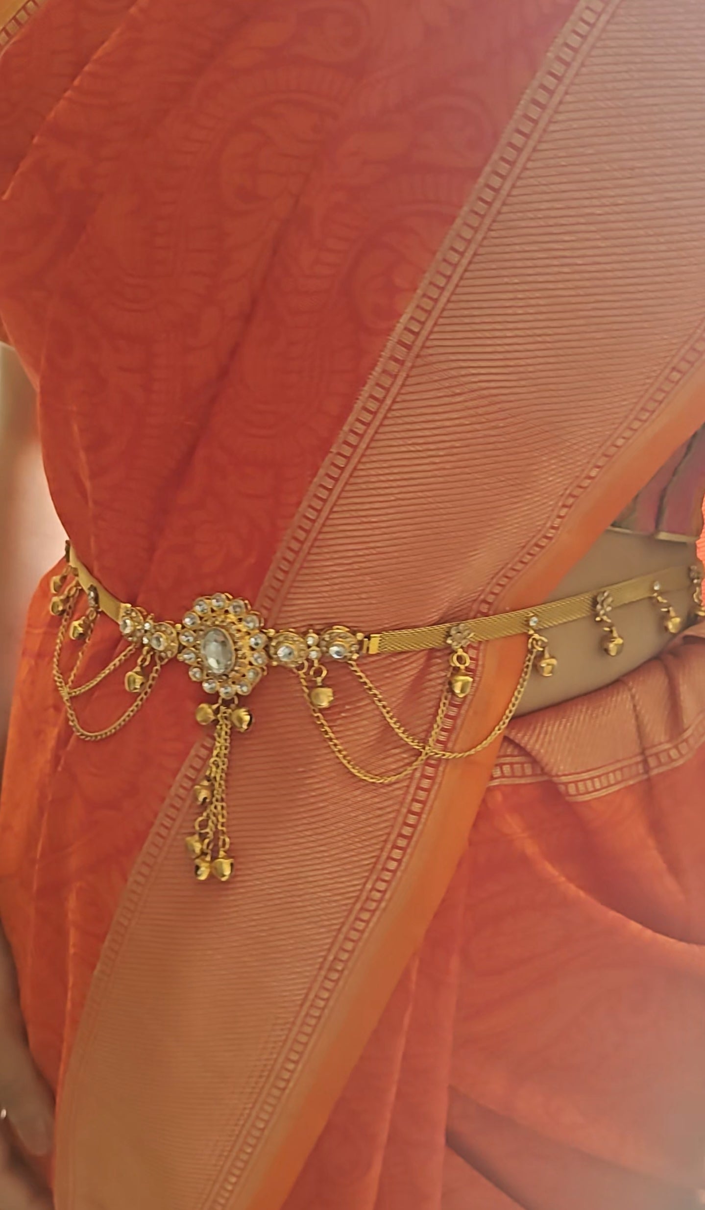 Belt with red/clear stone in centre and hangings all around