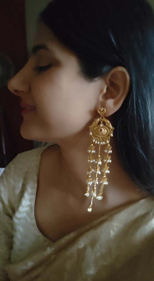 Gold earrings with pearls clusters hanging on three chains
