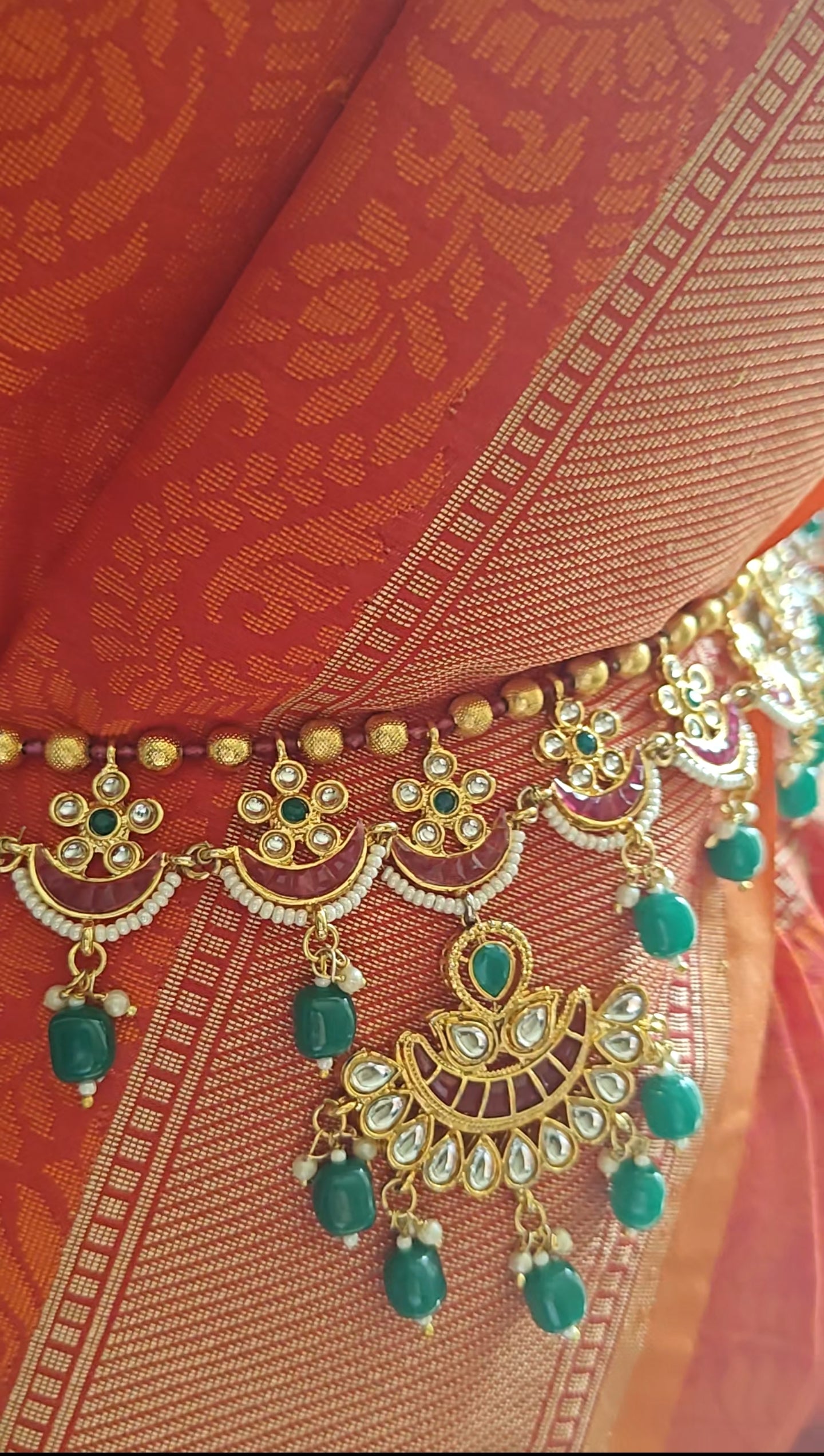 Golden belt with kundan,pink stones and green stone hangings