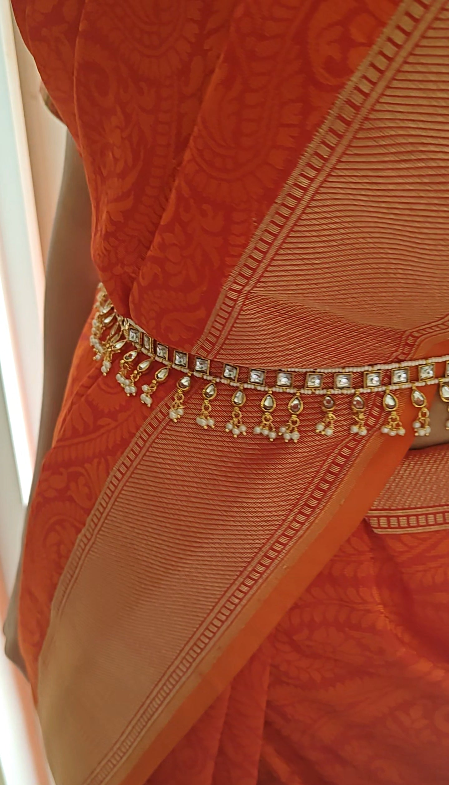 Golden belt with kundan on pearl strings, hangings below